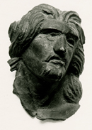 Applique con testa di guerriero celta da Luceria, età romana.